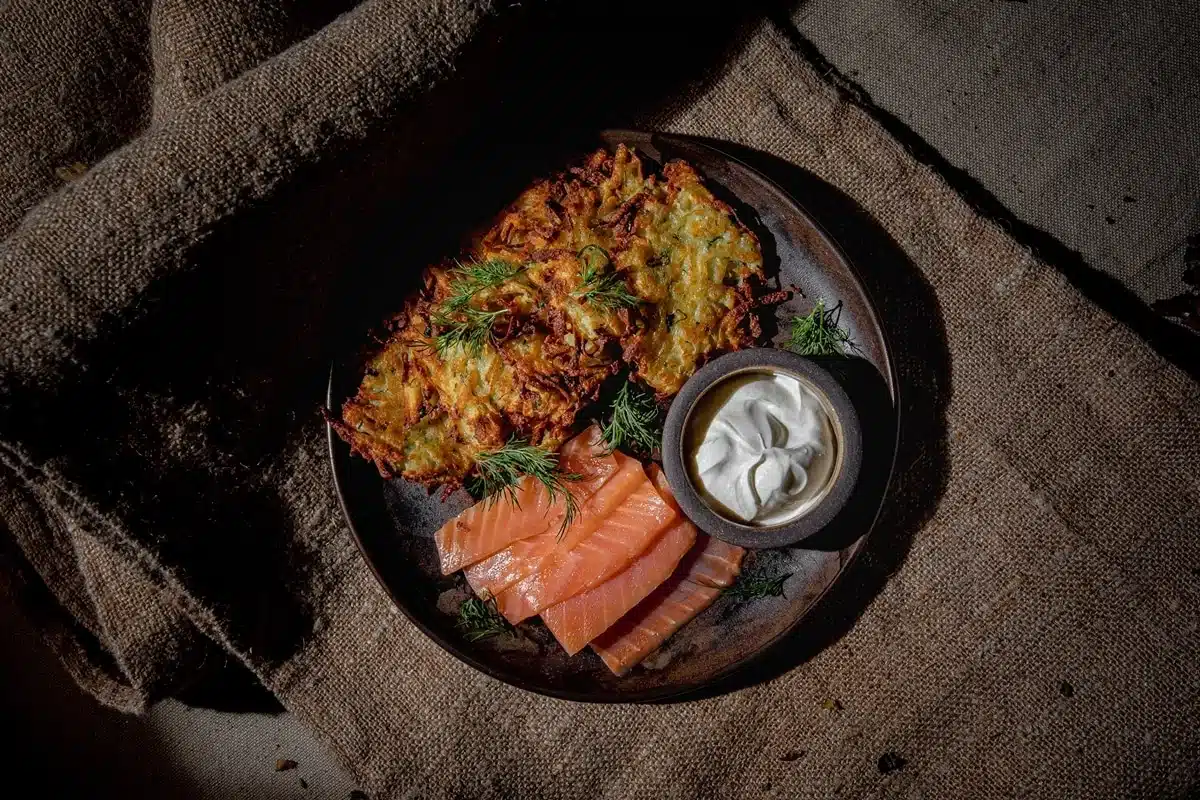 Potato pancakes with sour cream and trout
